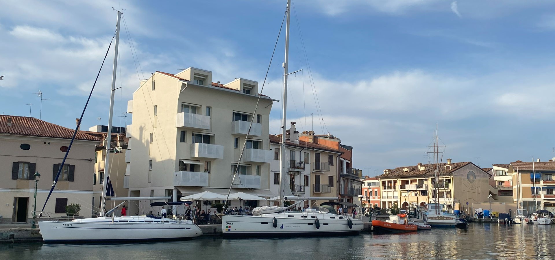 SY HERA berthed at the pier in Grado town harbour